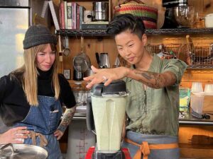 Chefs Carolynn Ladd and Kristen Kish blend ingredients in the kitchen at Ladd's restaurant in North Haven, Maine. (National Geographic/Missy Bania